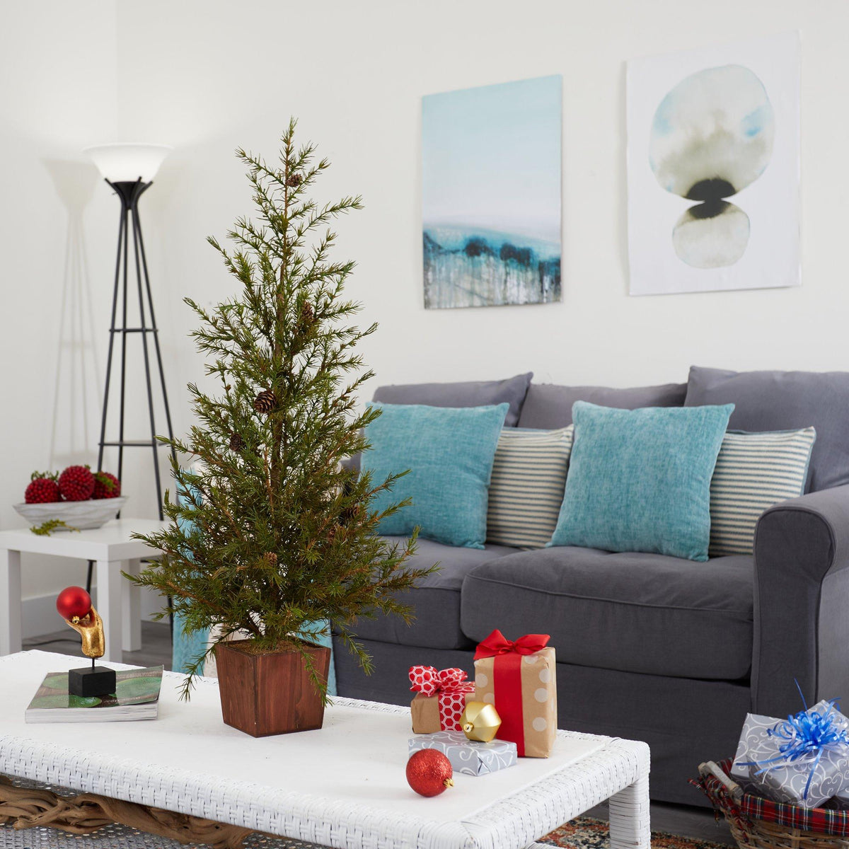 a christmas tree on a coffee table in a living room