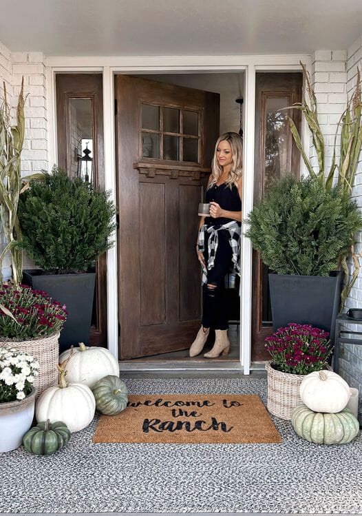 a woman standing in front of a door