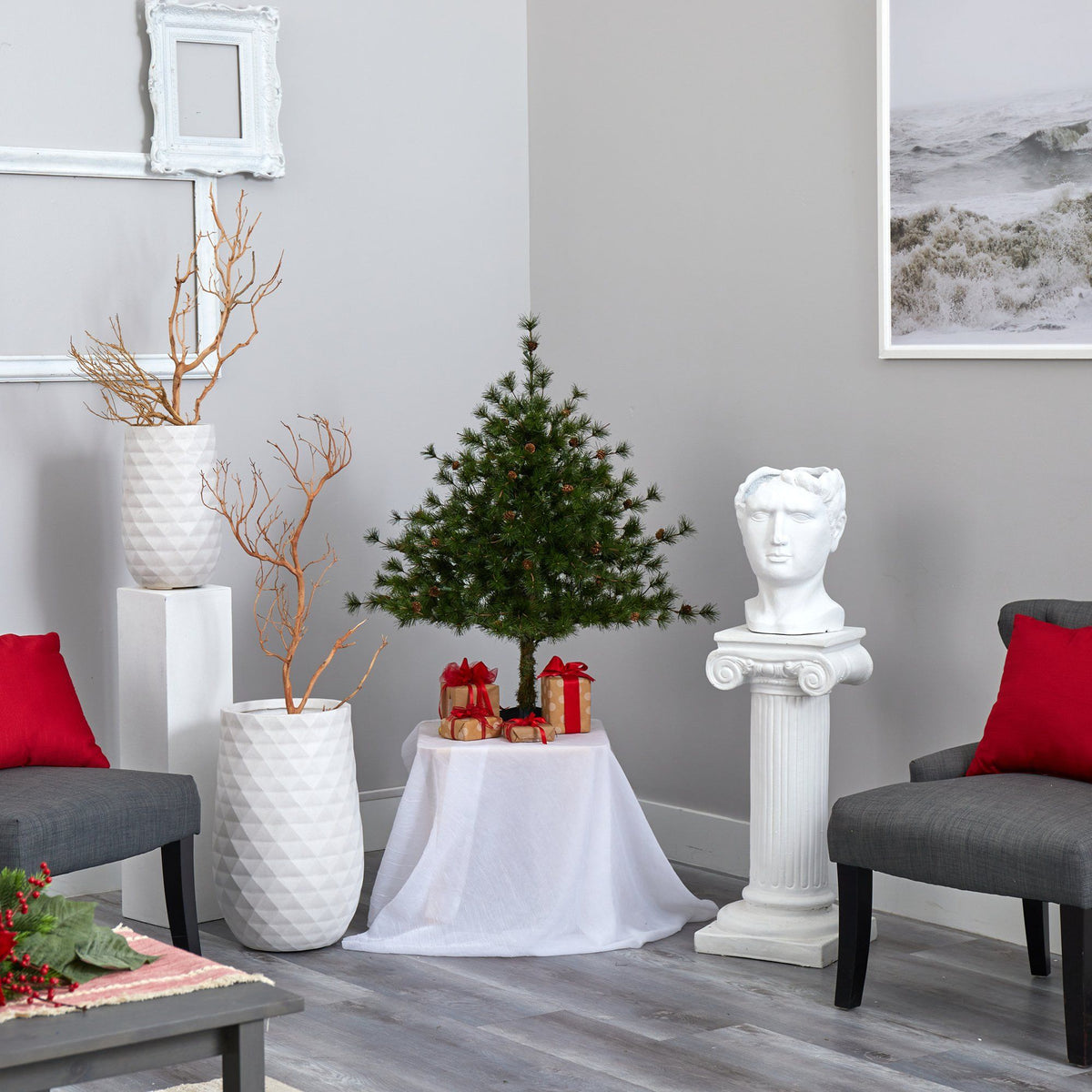 a room with a small tree and statues