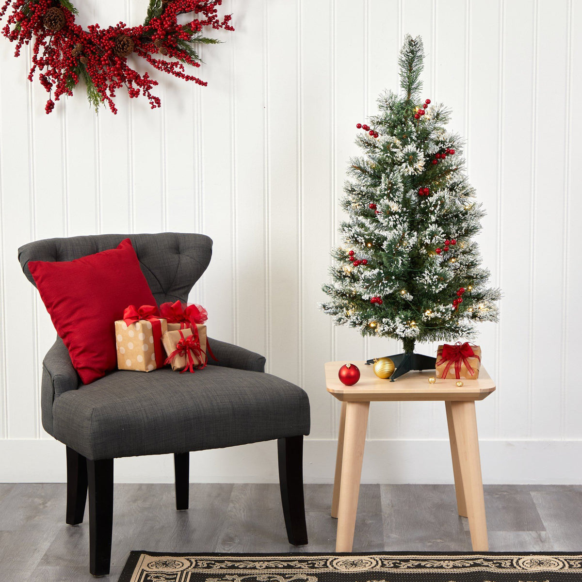 a christmas tree and a small table with presents
