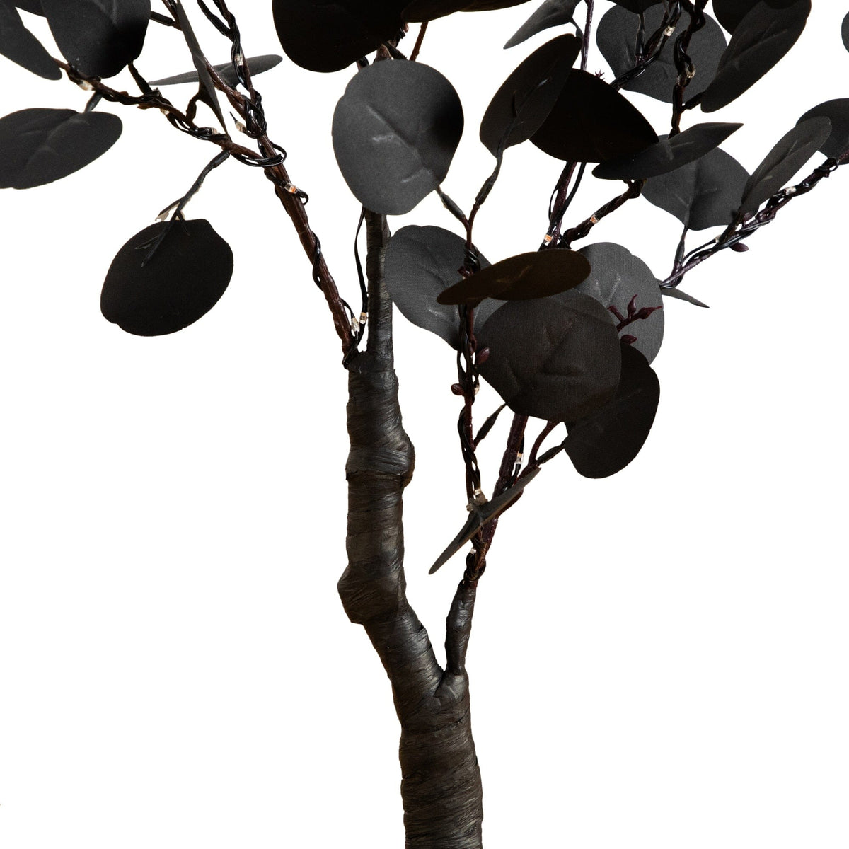 a black tree with black leaves