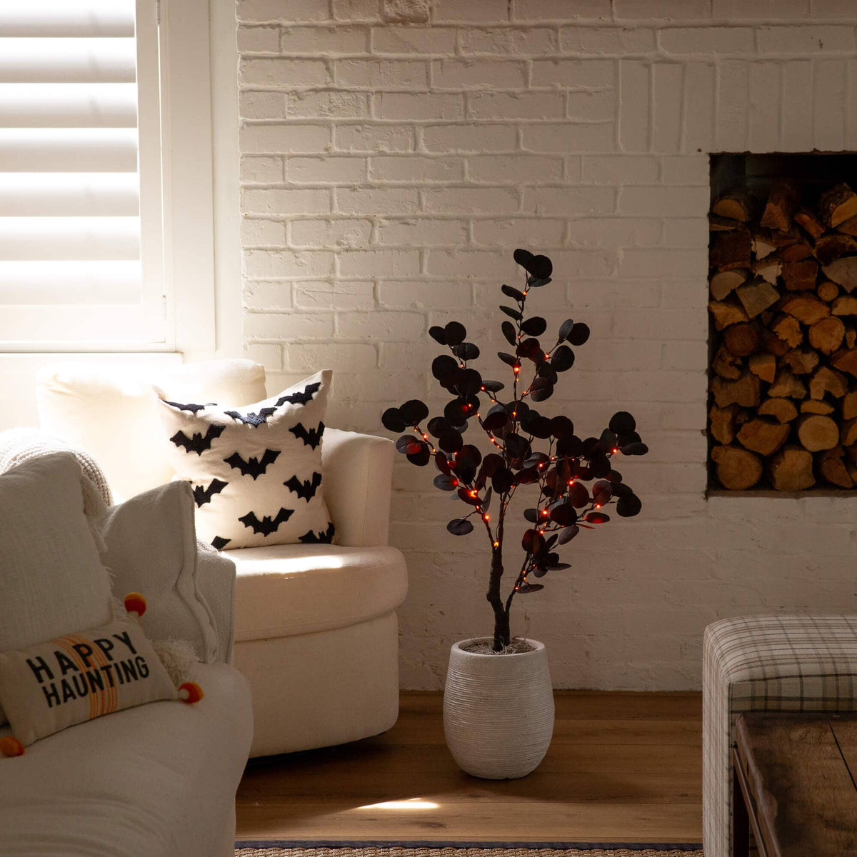 a room with a white couch and a white fireplace