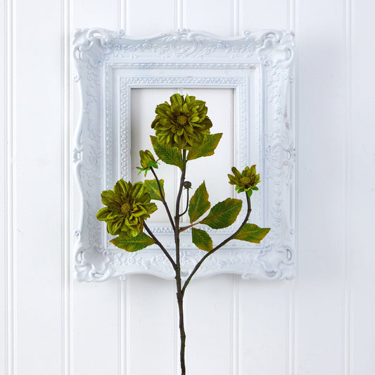 a green flower in a white frame