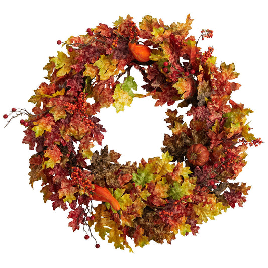 a wreath with leaves and fruits