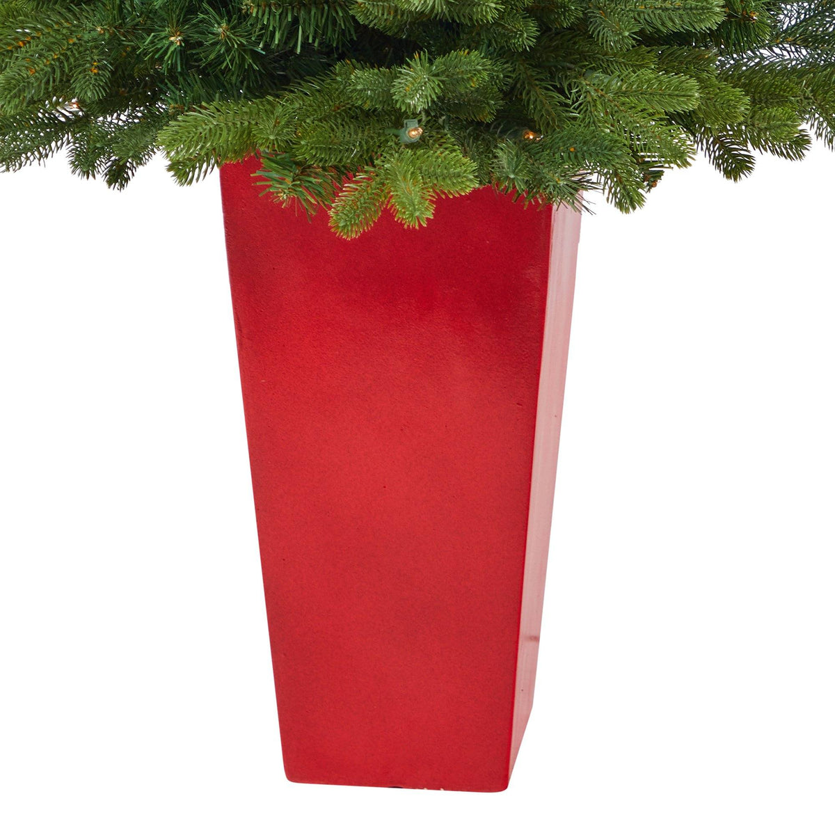 a red rectangular planter with green leaves