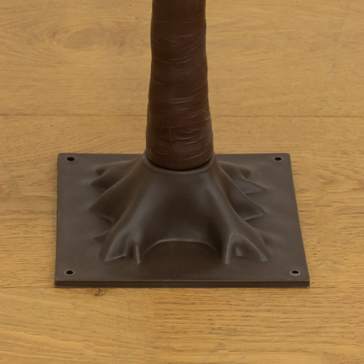 a brown plastic object with a base