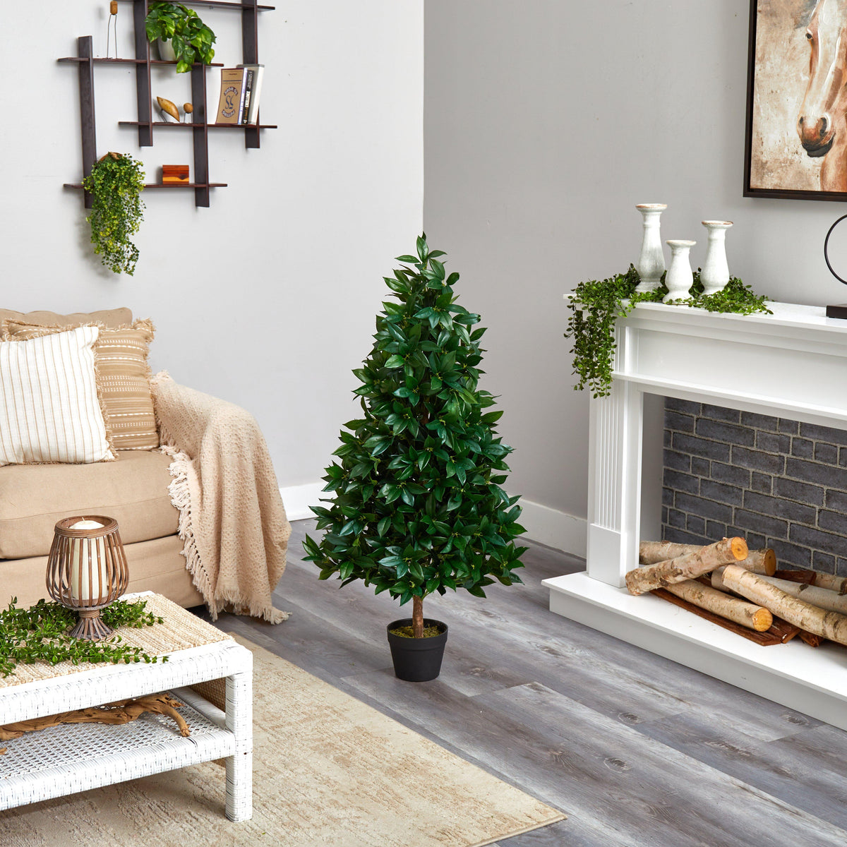 a living room with a tree and fireplace