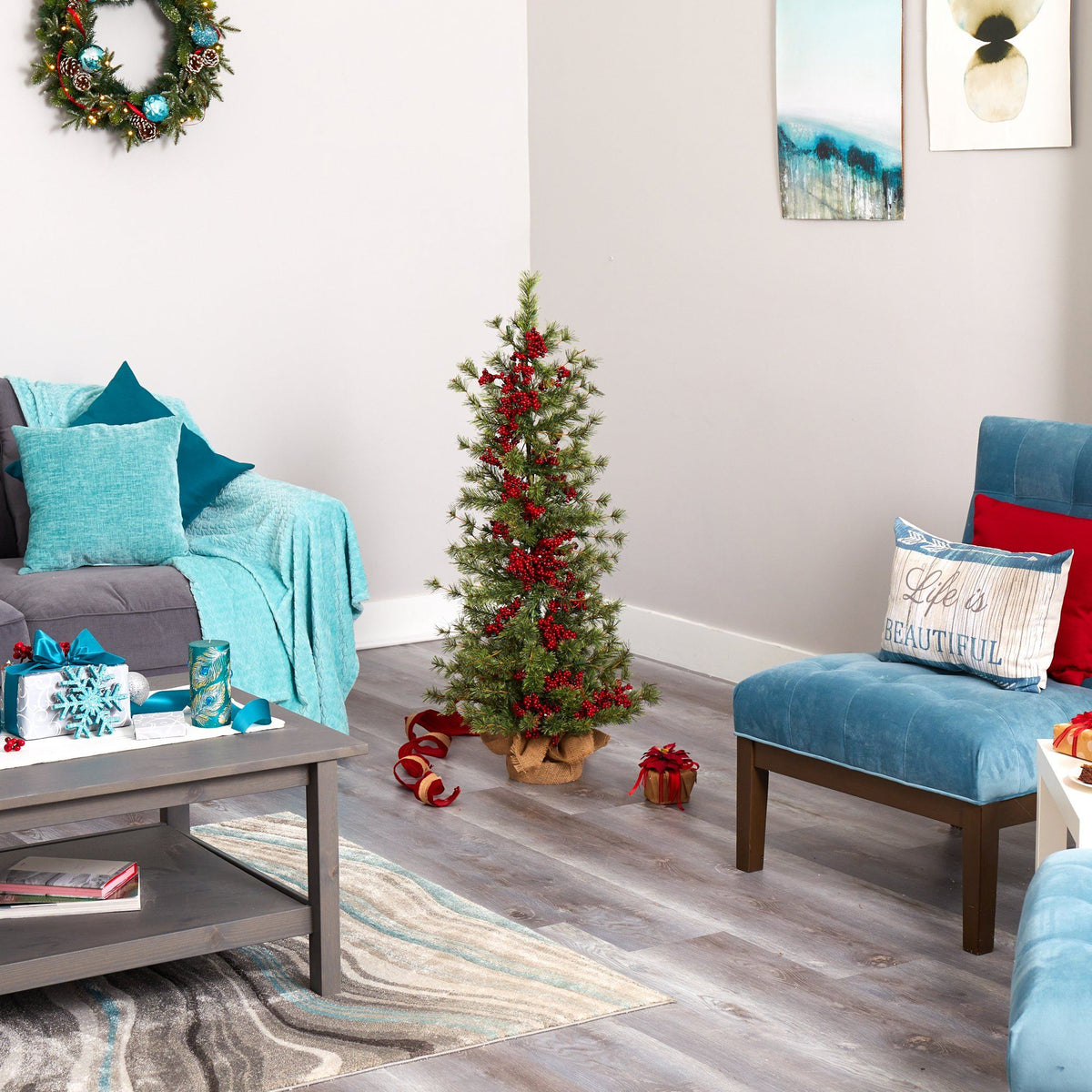 a living room with a christmas tree and a small tree