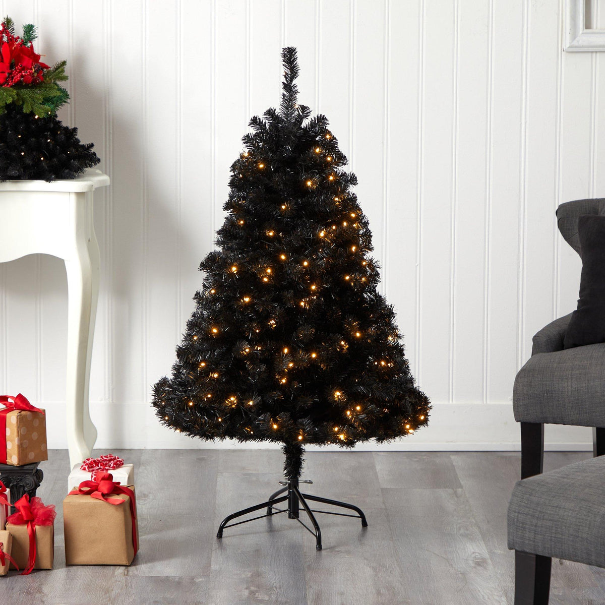 a christmas tree with lights and presents