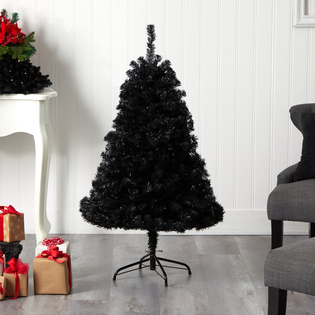 a black christmas tree with presents