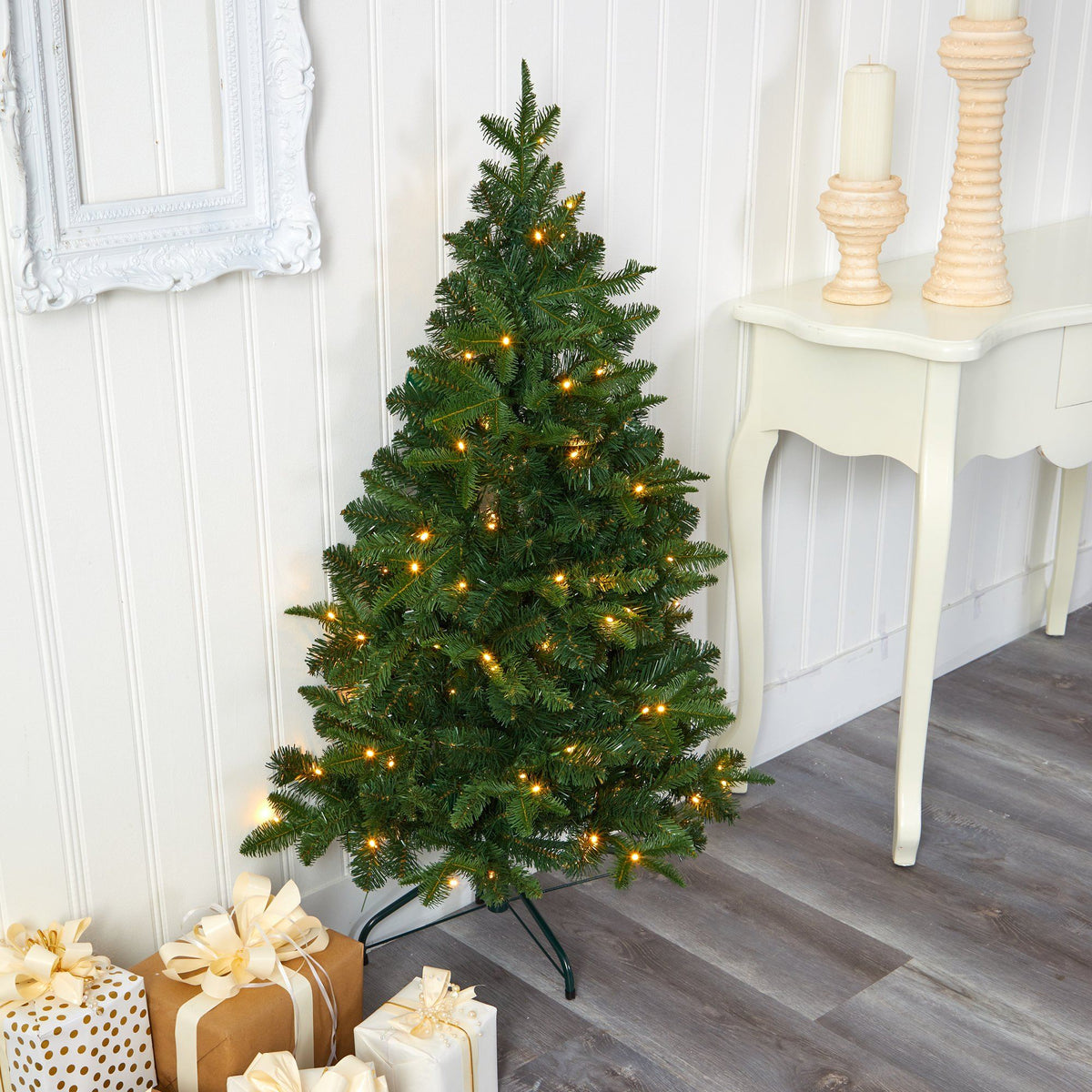 a christmas tree with lights and presents