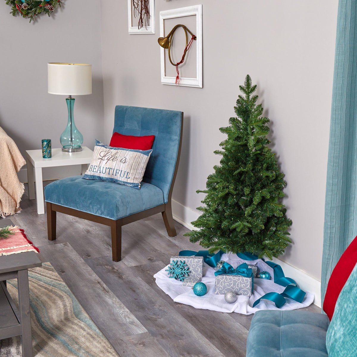 a christmas tree and a small tree in a room