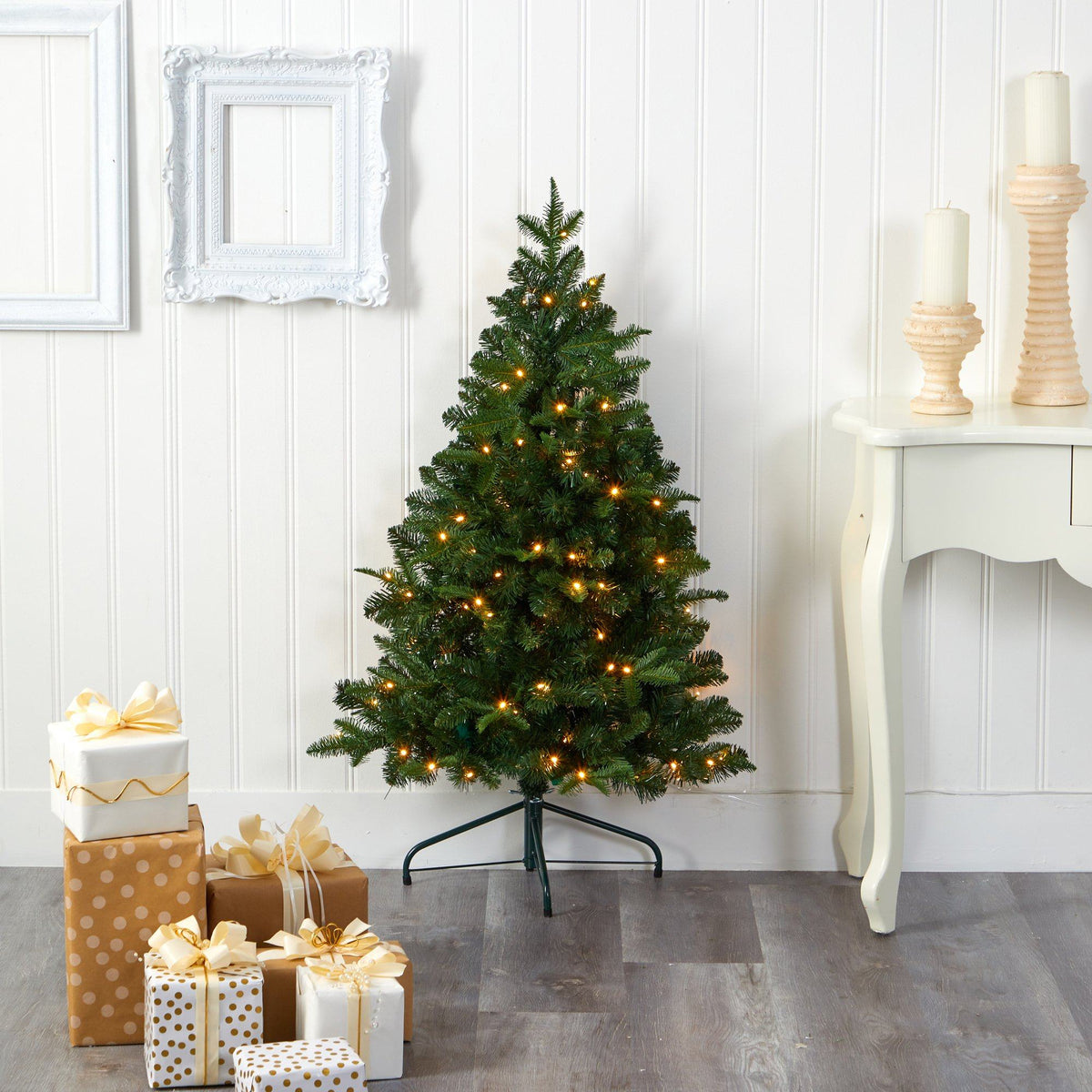 a christmas tree with lights and presents