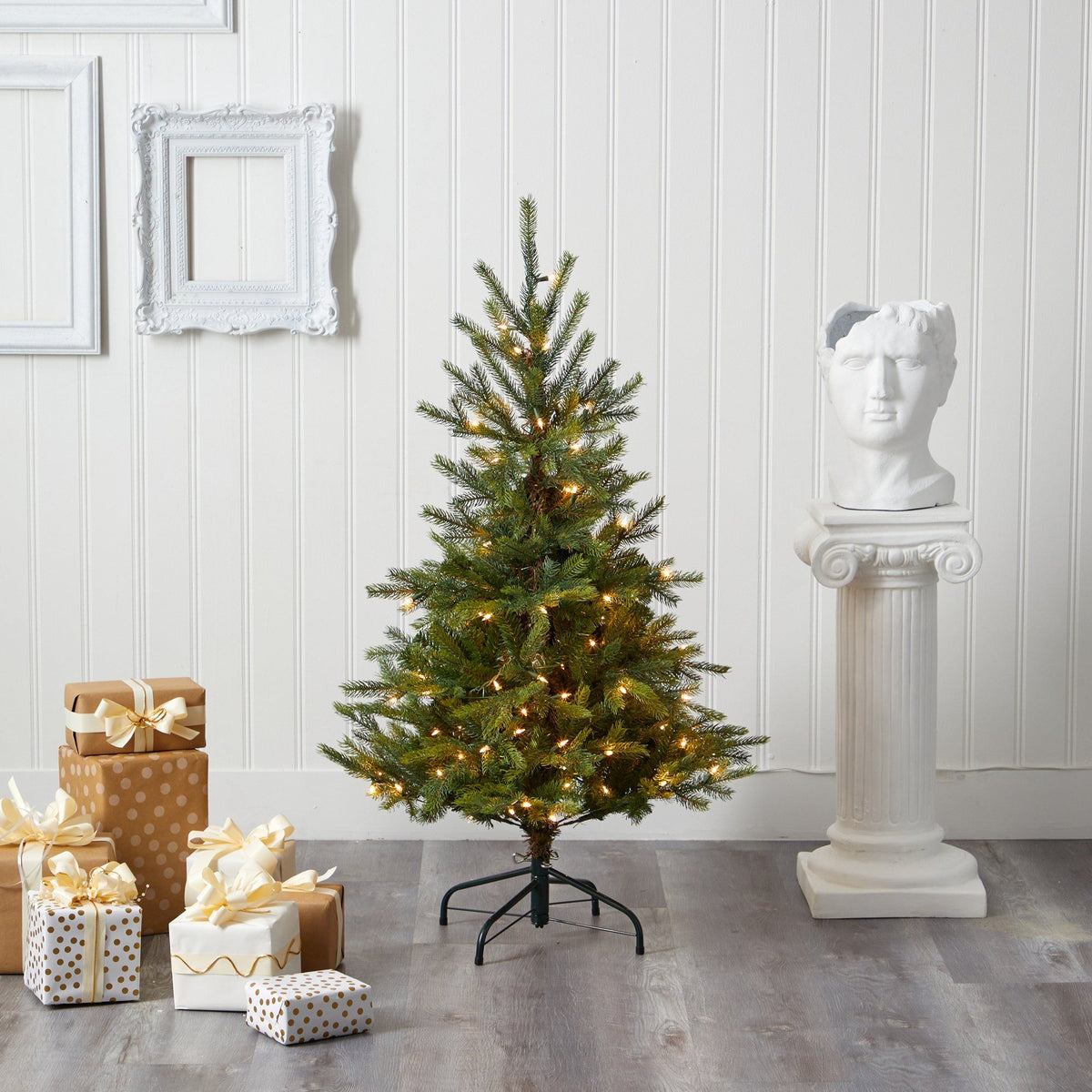 a christmas tree with lights and presents