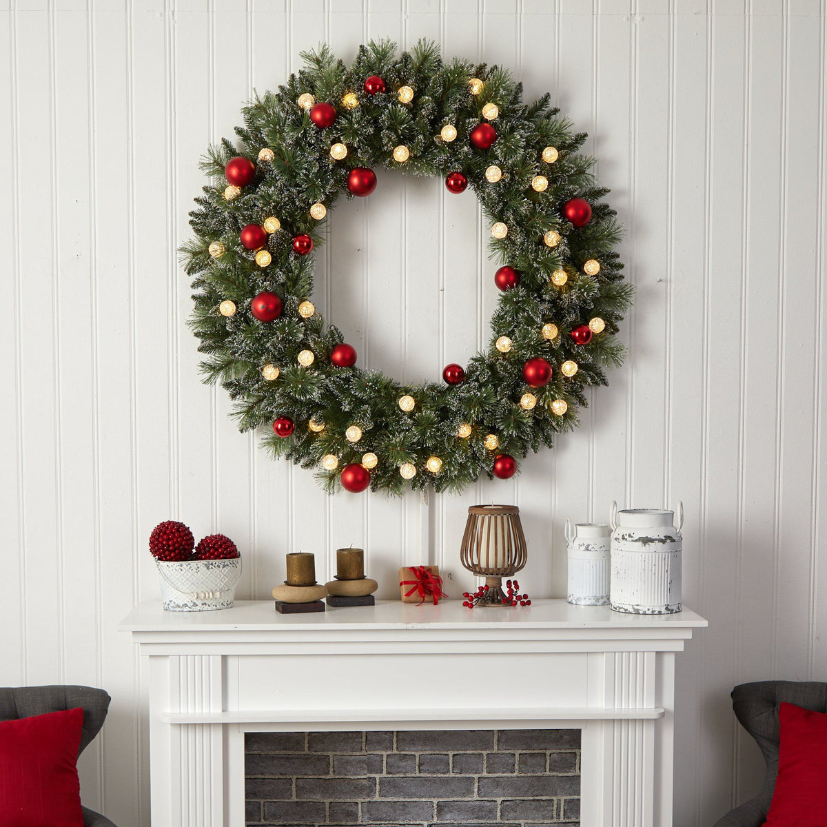 a wreath on a fireplace