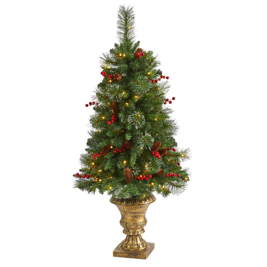 a christmas tree in a gold vase