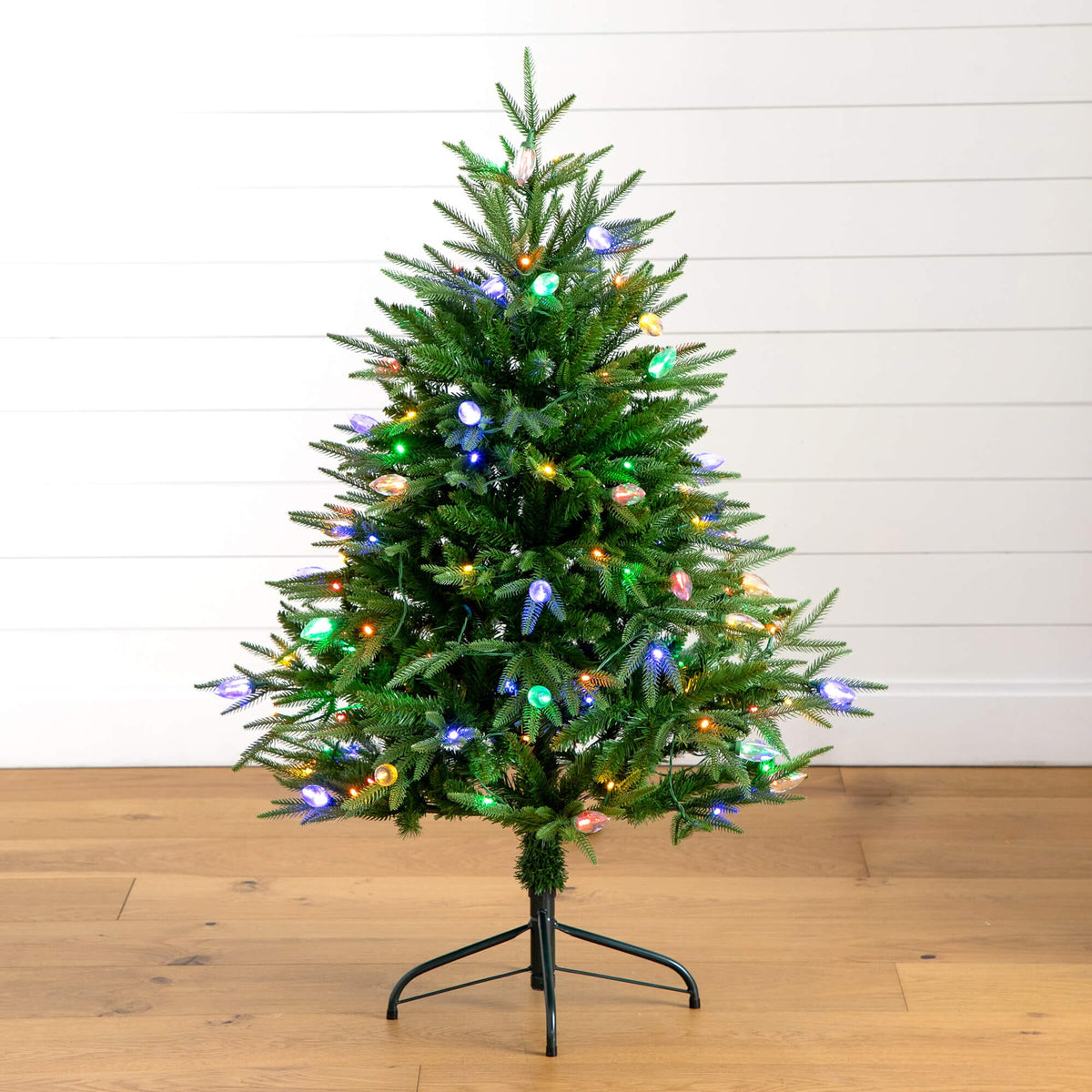 a small christmas tree with lights