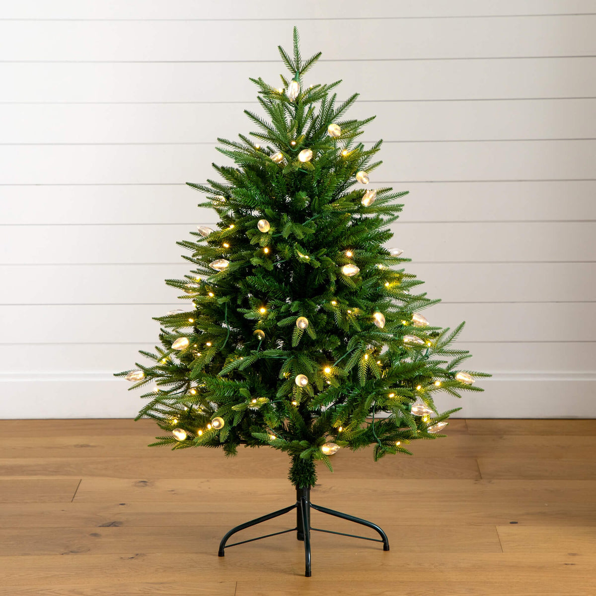 a small christmas tree with lights on it
