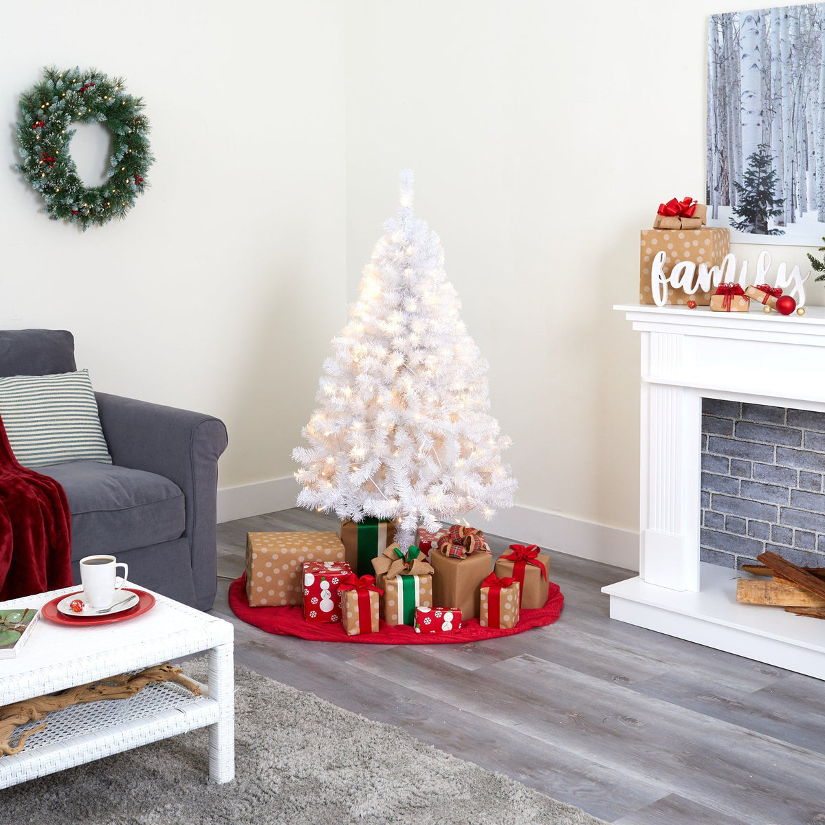 a christmas tree with presents around it