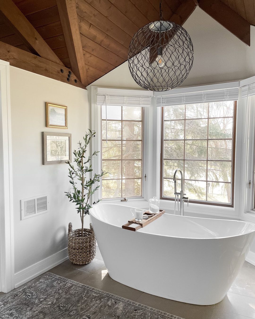 a bathroom with a tub and windows