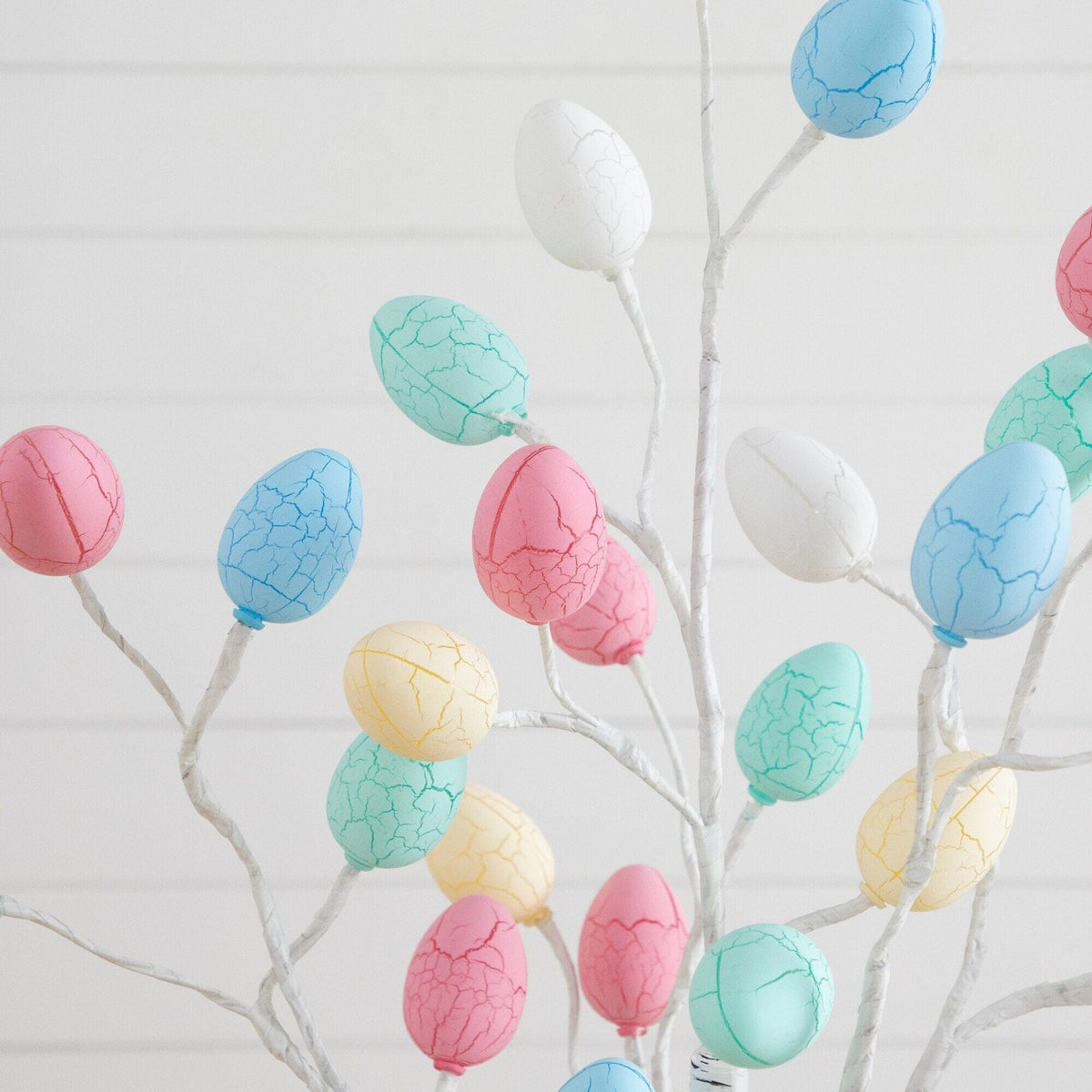 a tree with colorful eggs
