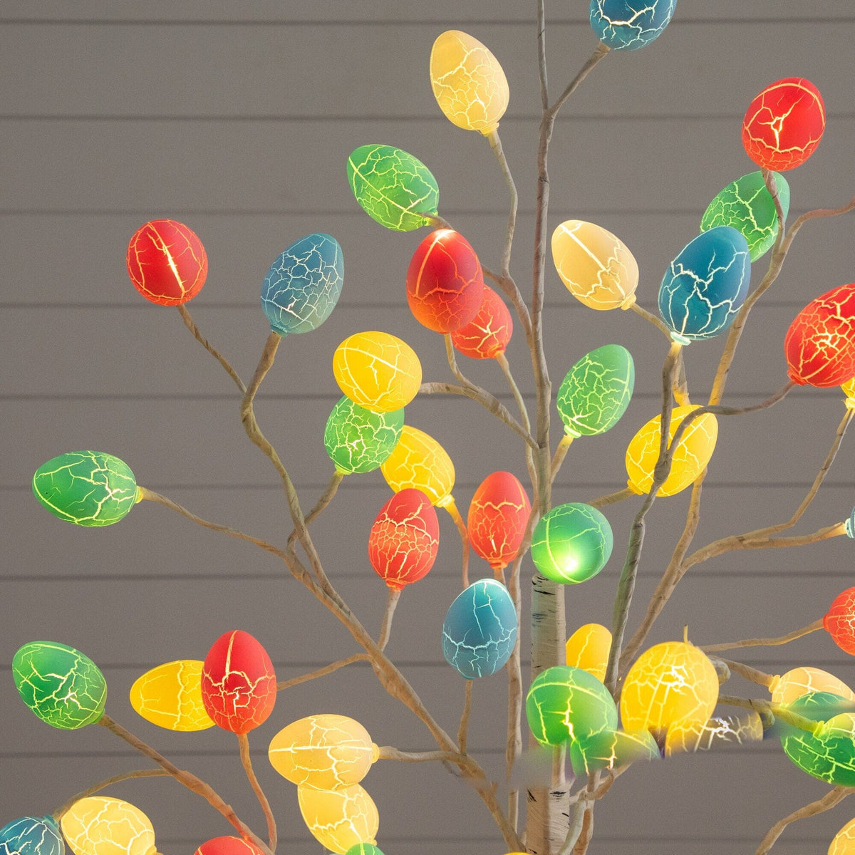 a tree with colorful eggs on it