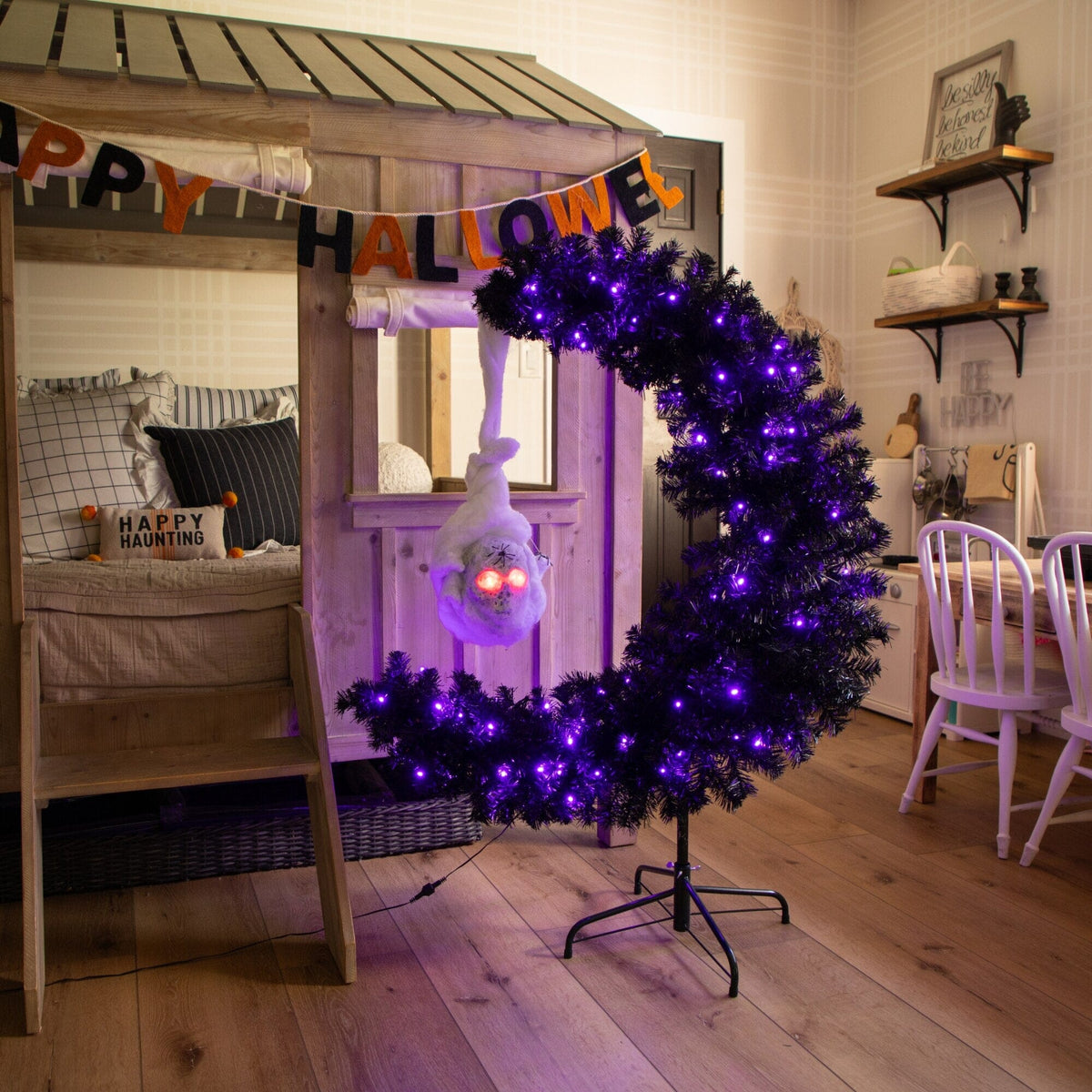 a purple and white christmas tree with lights