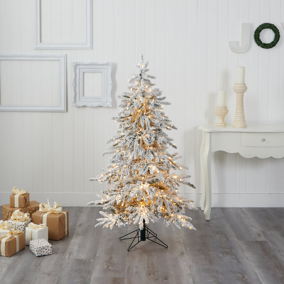 a christmas tree with lights and presents