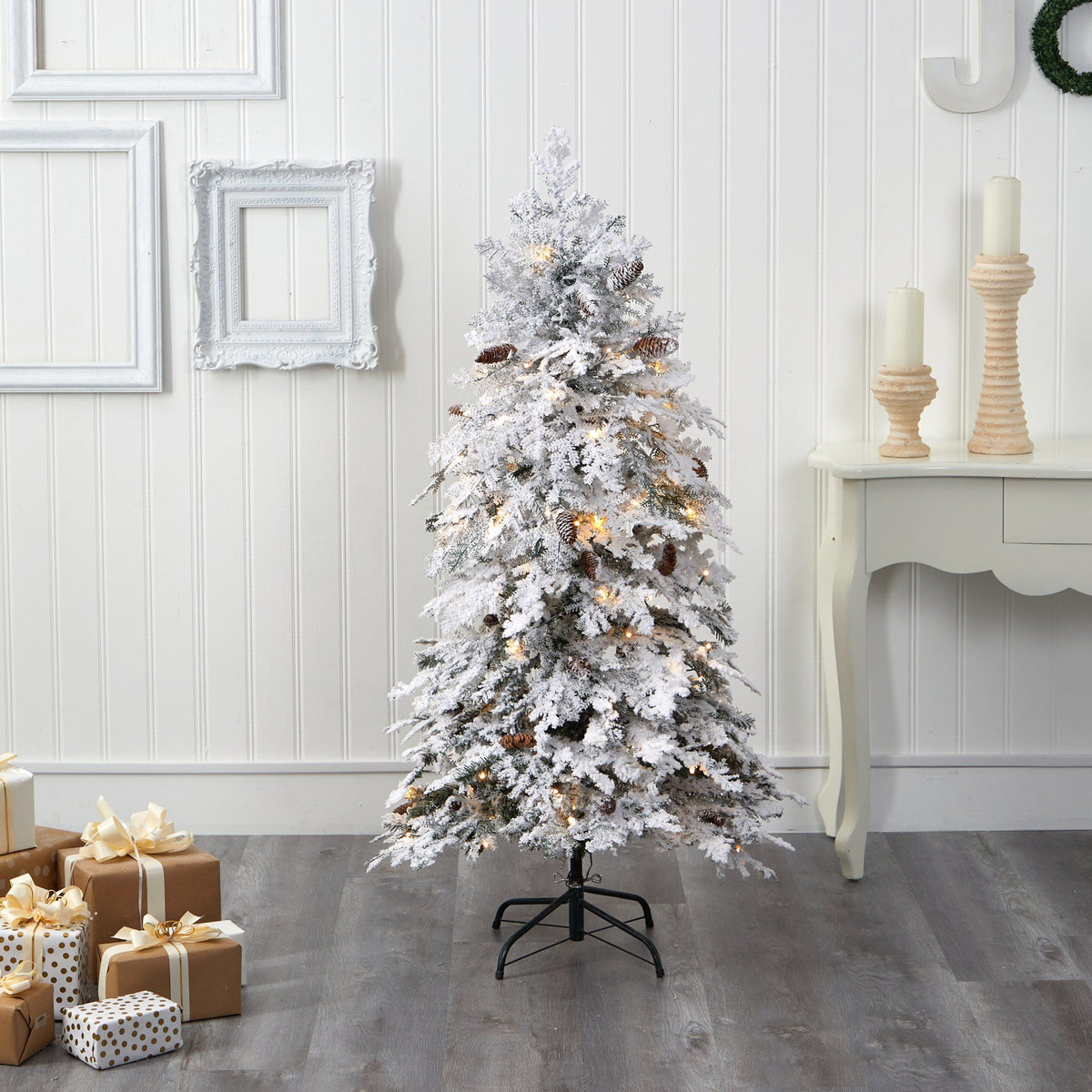 a christmas tree in a room with presents