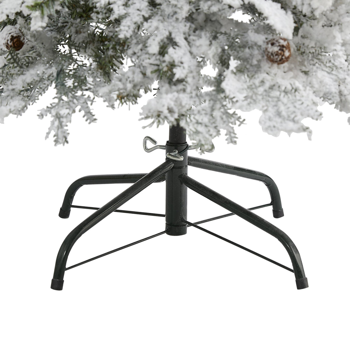 a snow covered tree with a stand