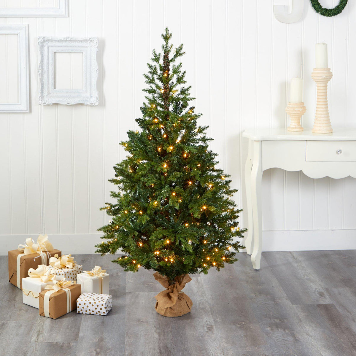 a christmas tree with lights and presents