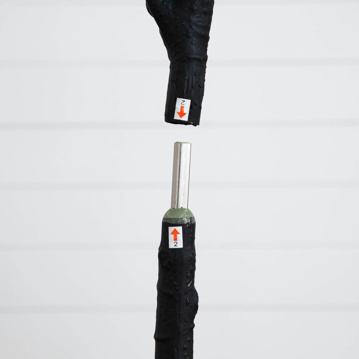 a black handle with a black handle and a black handle with a red arrow
