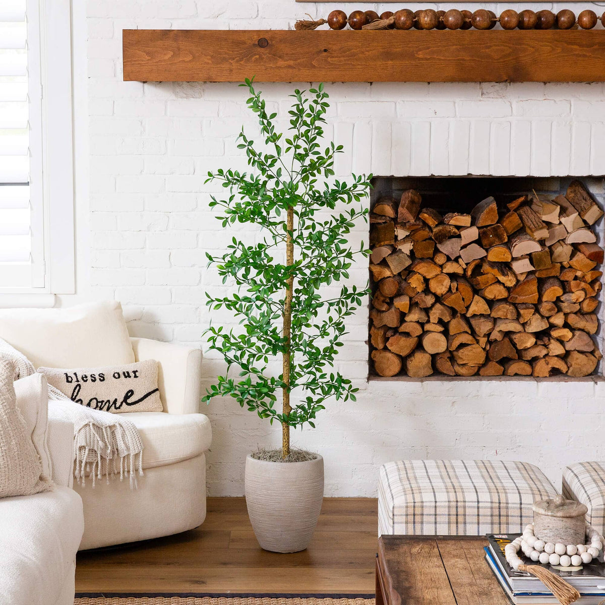 a room with a fireplace and a tree