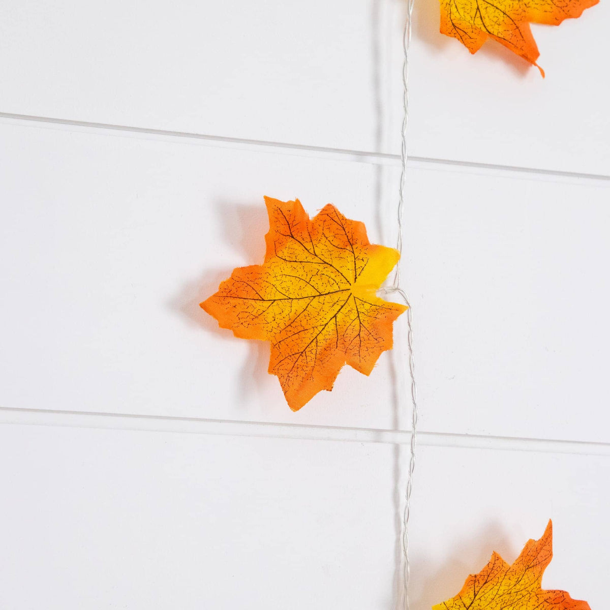 a string of orange and yellow leaves