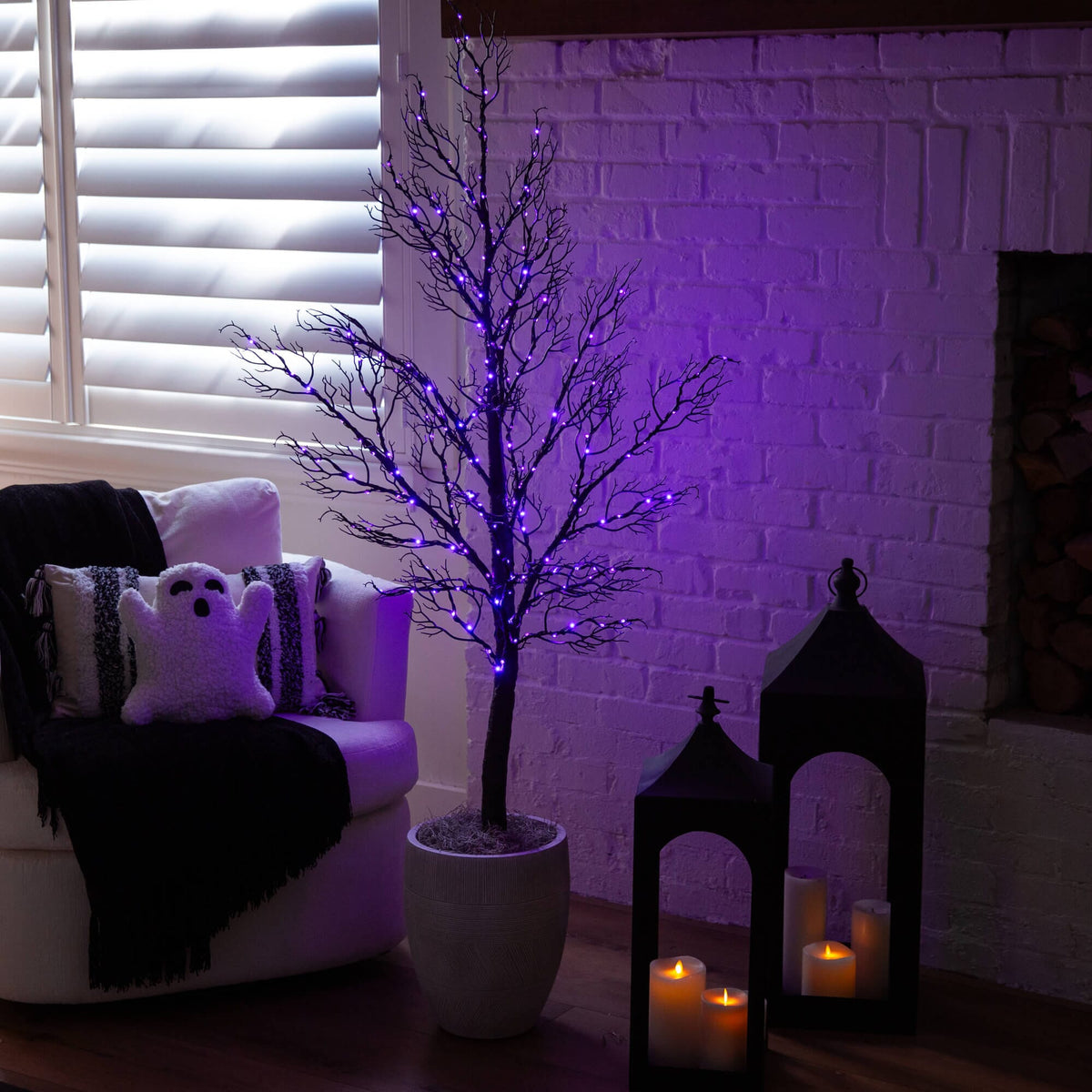 a purple lit tree in a room