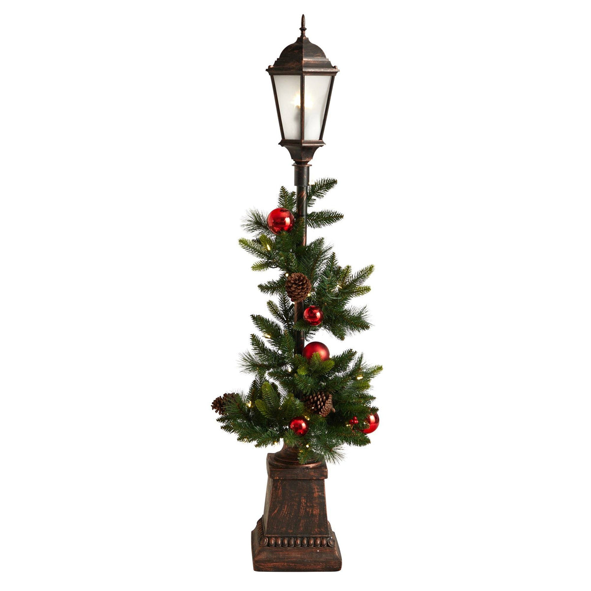 a christmas tree with a light post