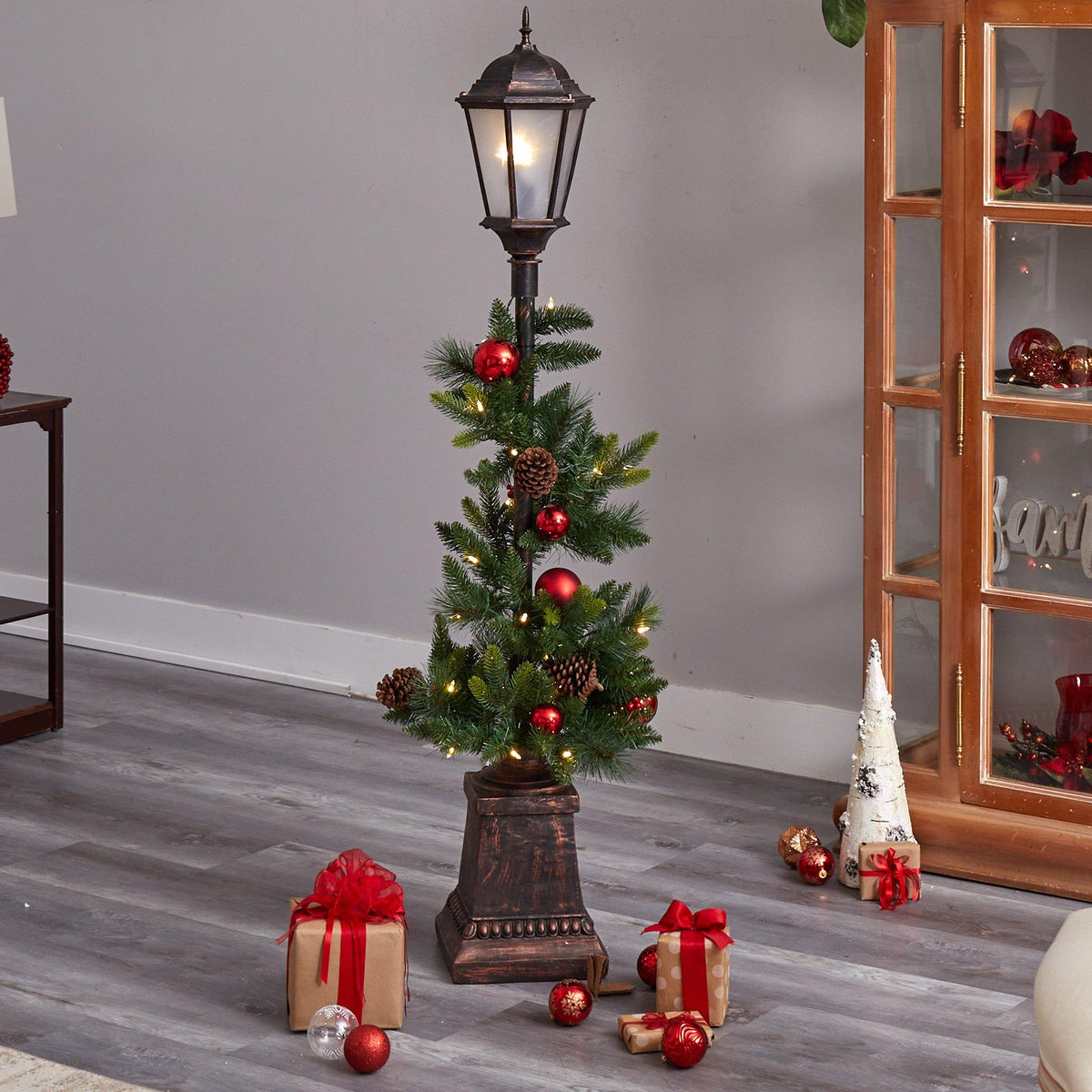 a christmas tree with lights and presents
