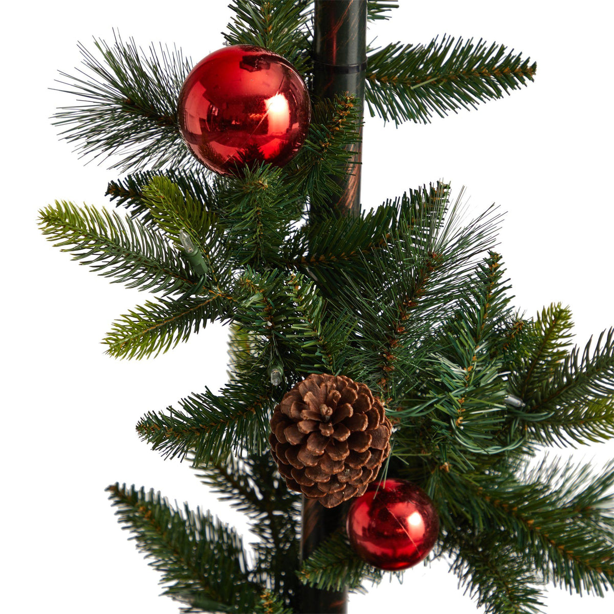 a pinecone and ornaments on a tree