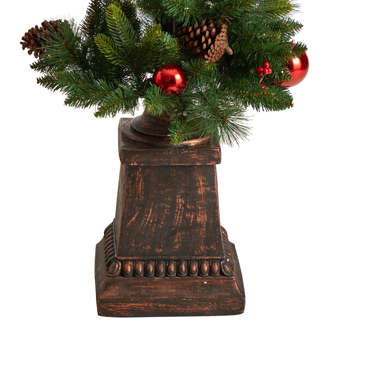 a tree with ornaments in a vase