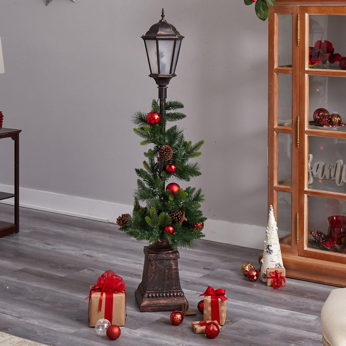 a christmas tree with ornaments and presents