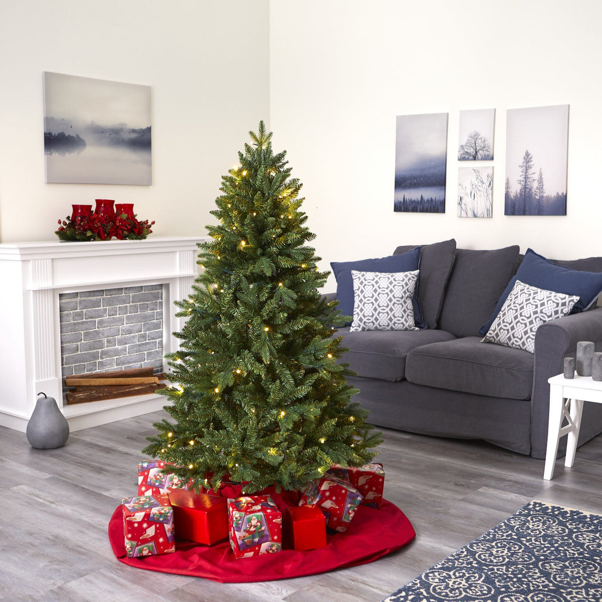 a christmas tree with presents around it