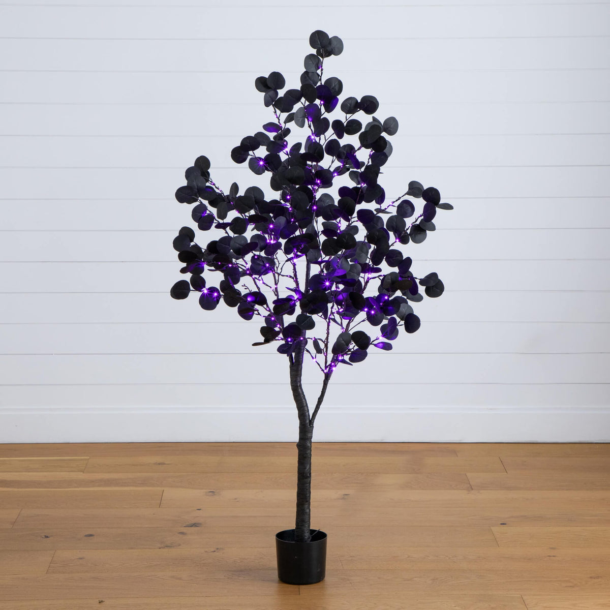 a tree with purple lights