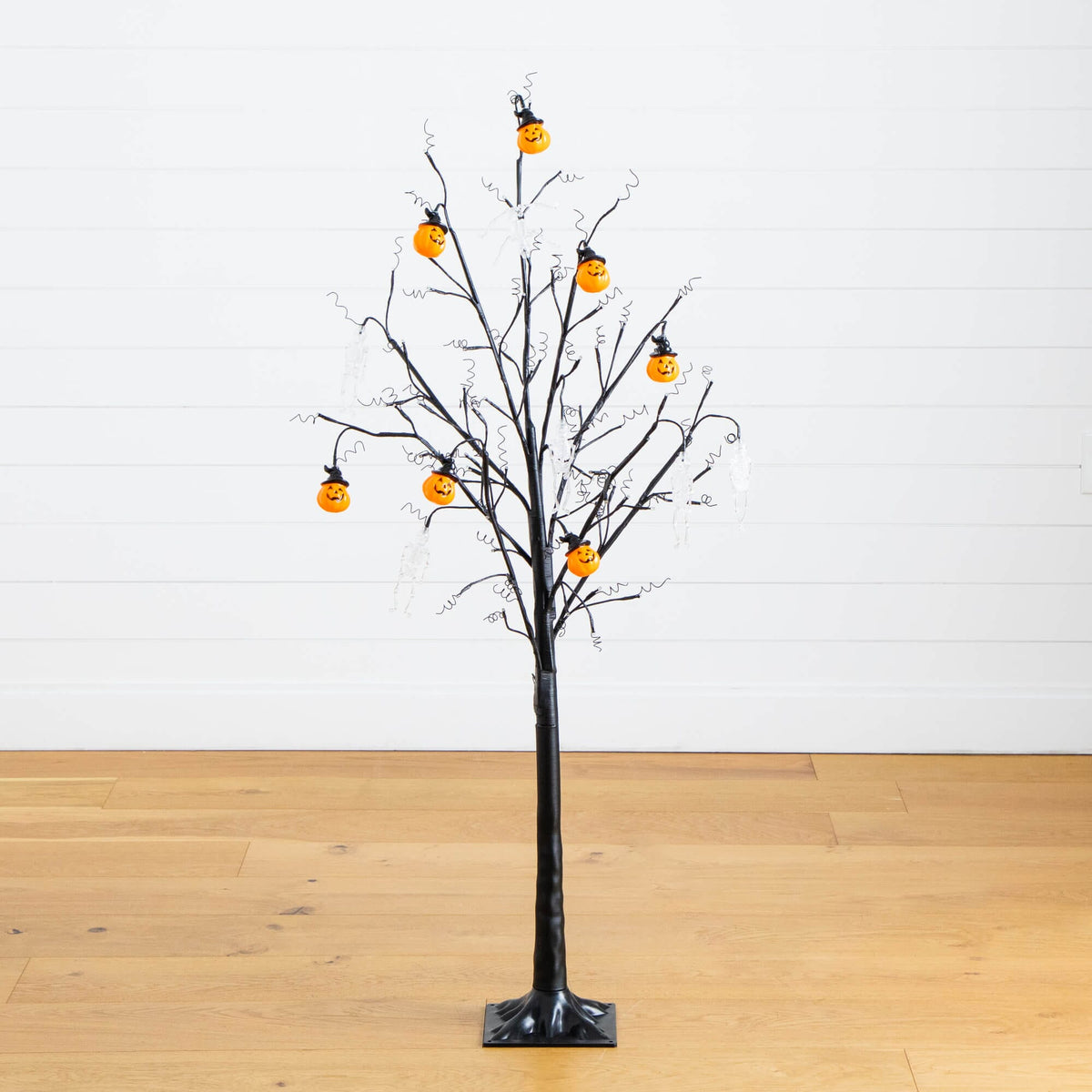 a tree with orange lights on it