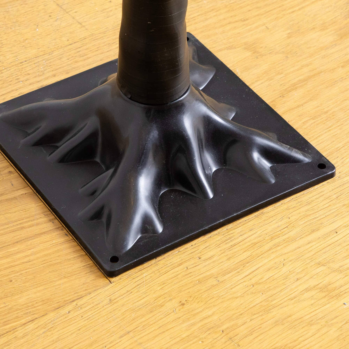 a black base with a black stem
