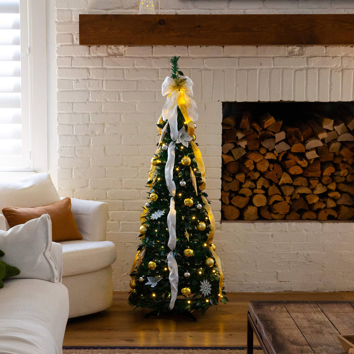 a christmas tree in a room with a fireplace