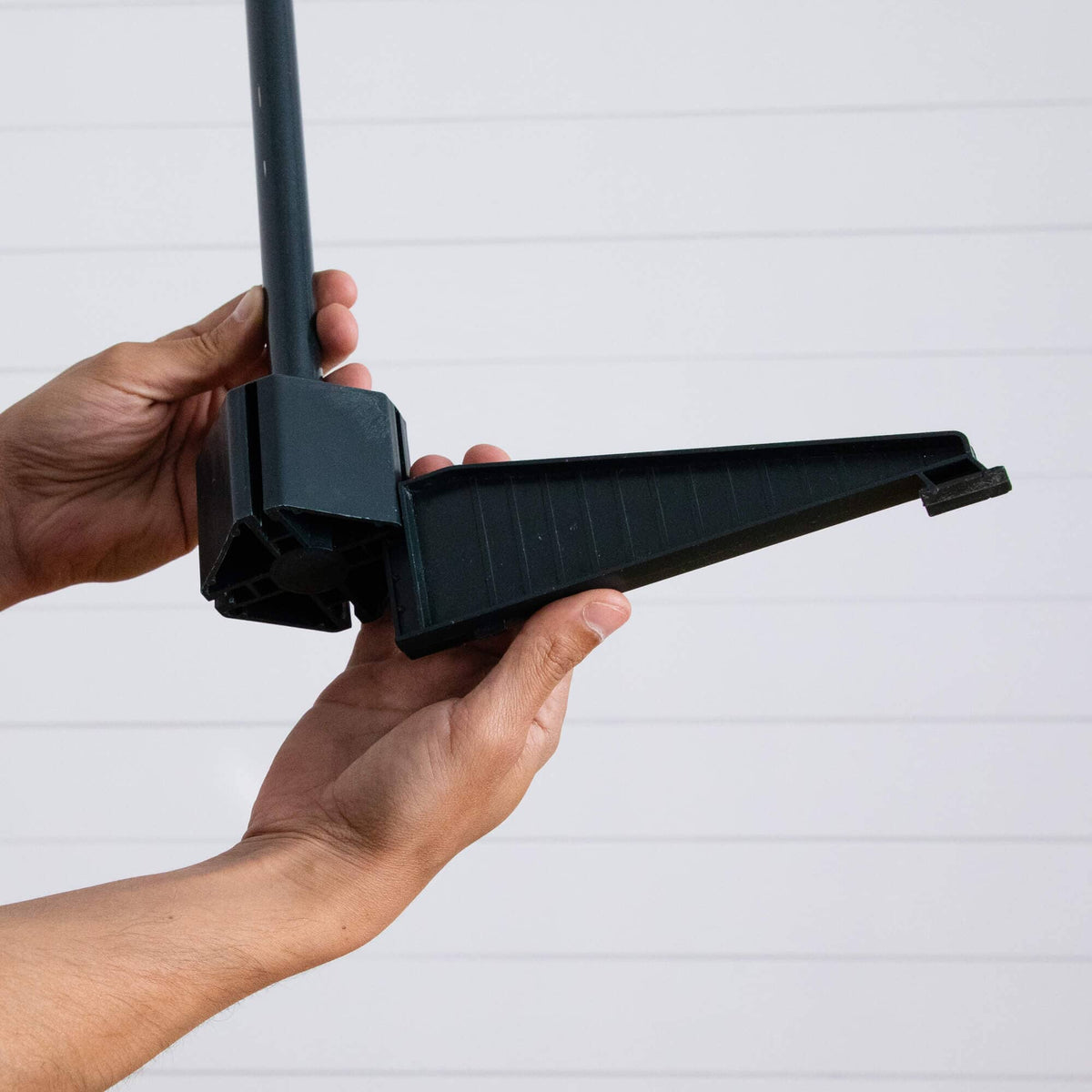 a person holding a black object