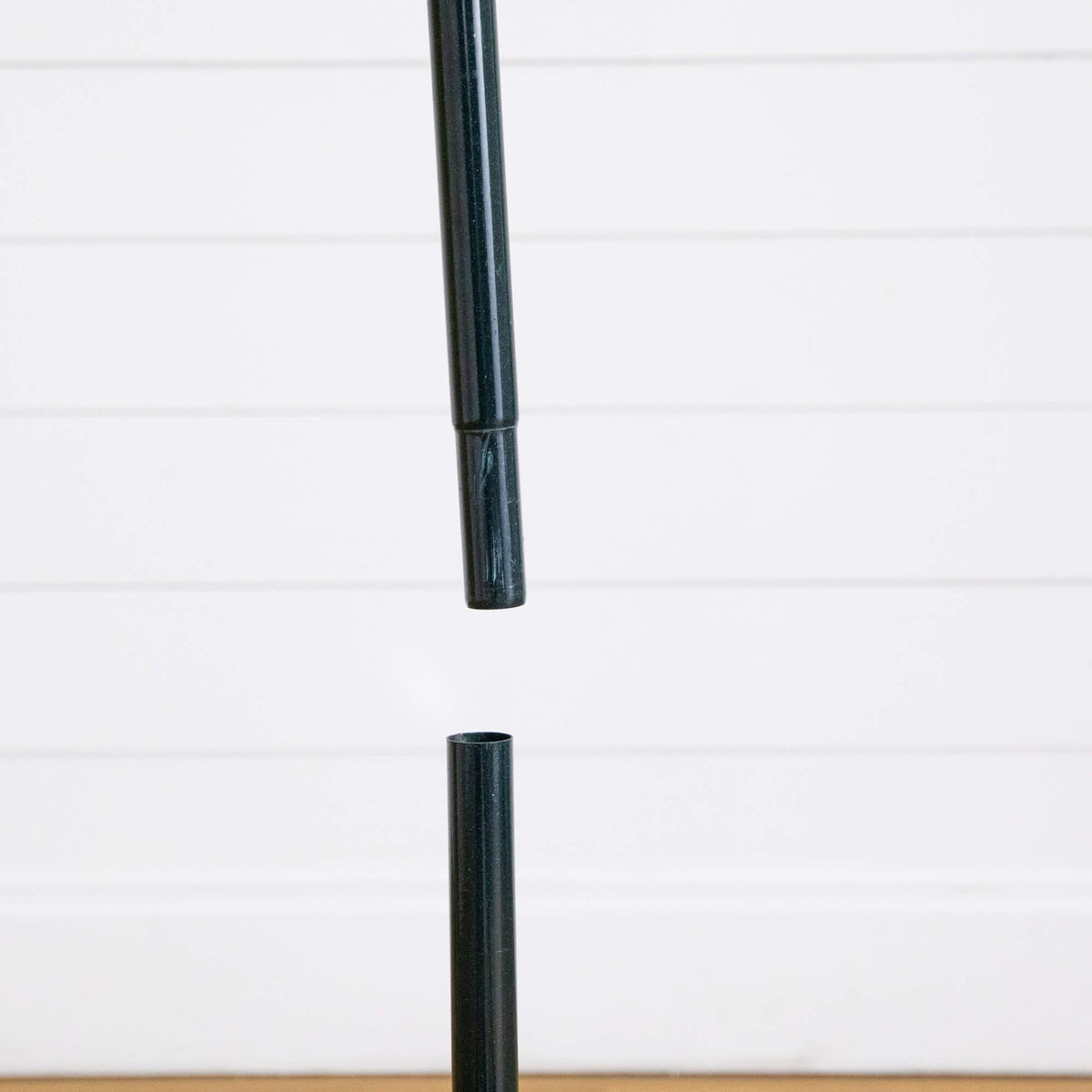 a black pen with a black handle