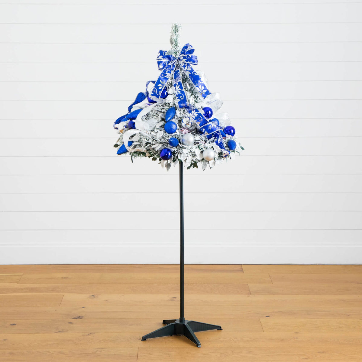 a christmas tree with blue and white ornaments