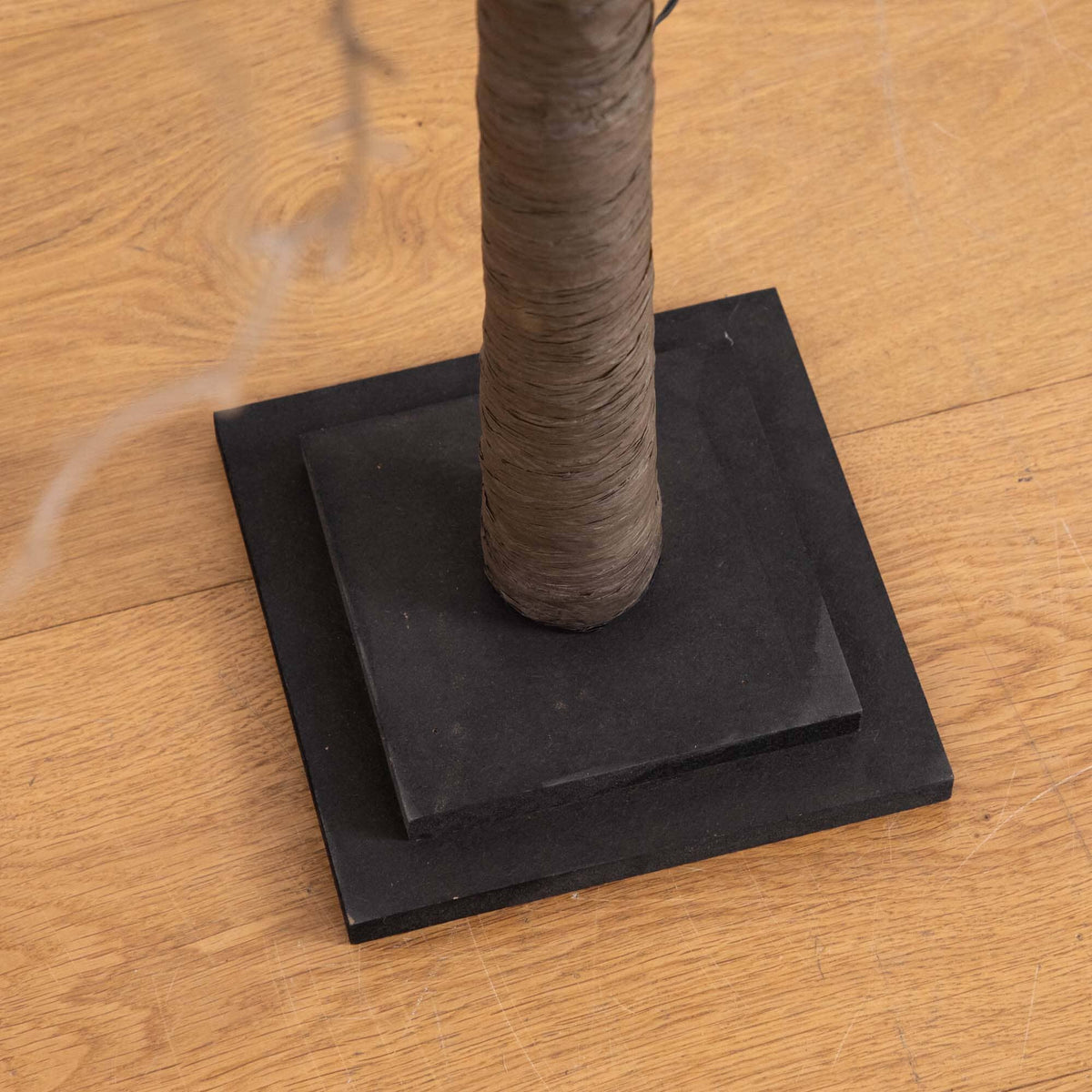 a tree on a wood floor