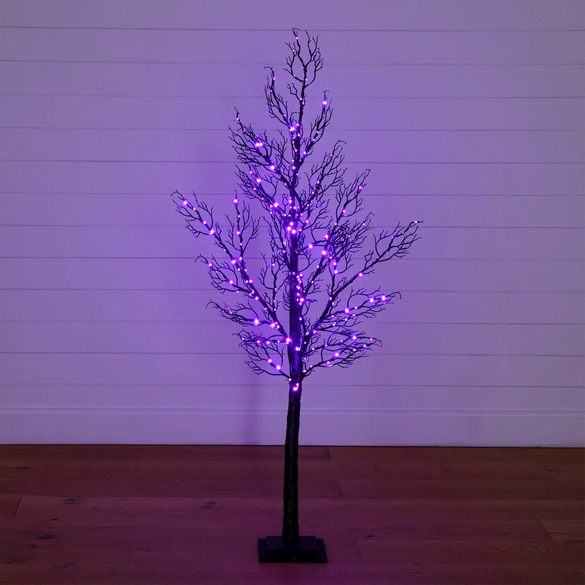a tree with purple lights